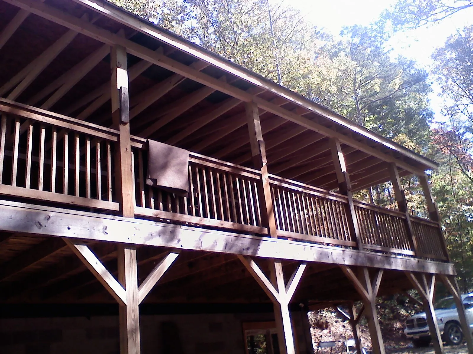 Timber framing under a new elevated porch and deck — Roof Leak Repair in Normal by Roofing Brothers